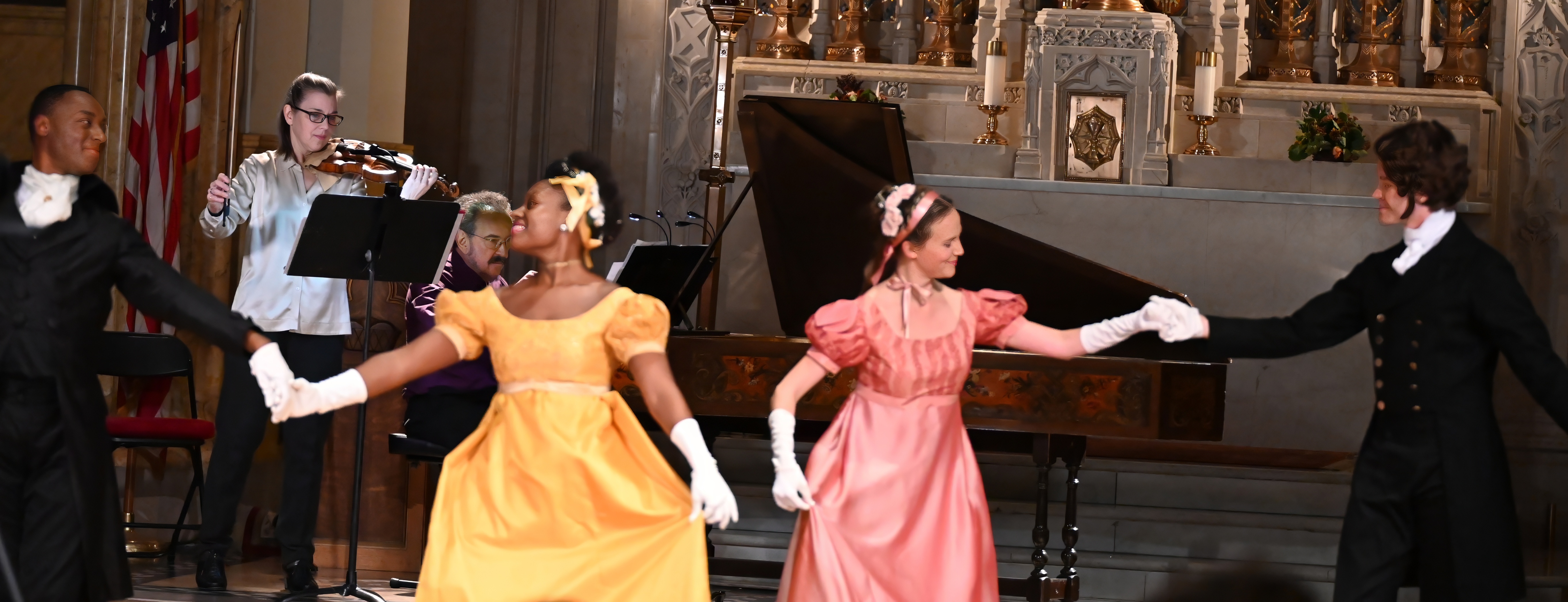Image of dancers and musicians, mid-performance. 